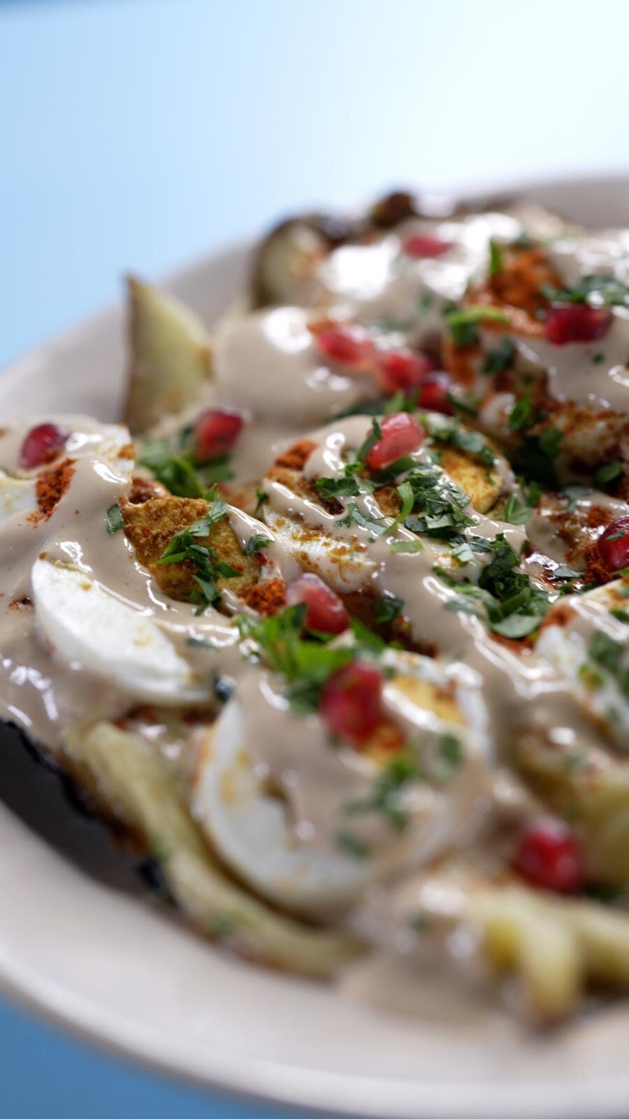 A dish from Yallah’s current menu on a blue table