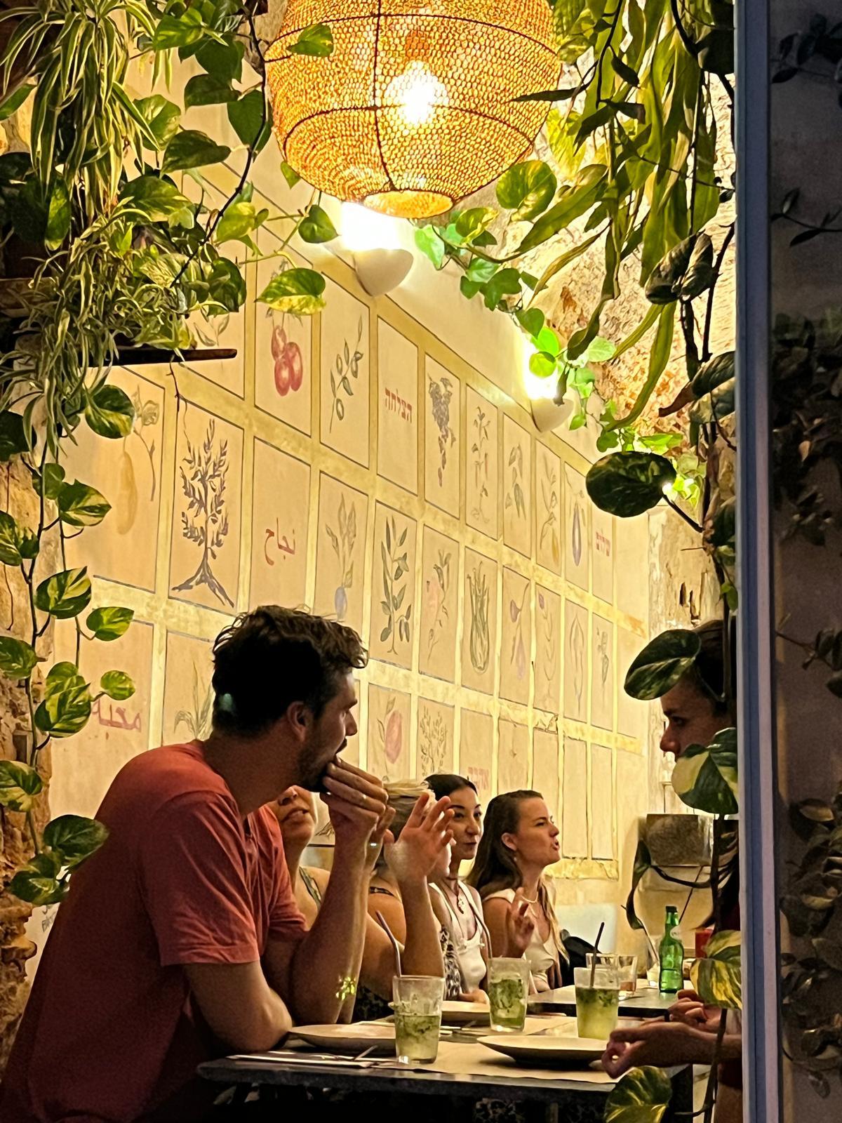 Guests sharing a meal inside Yallah